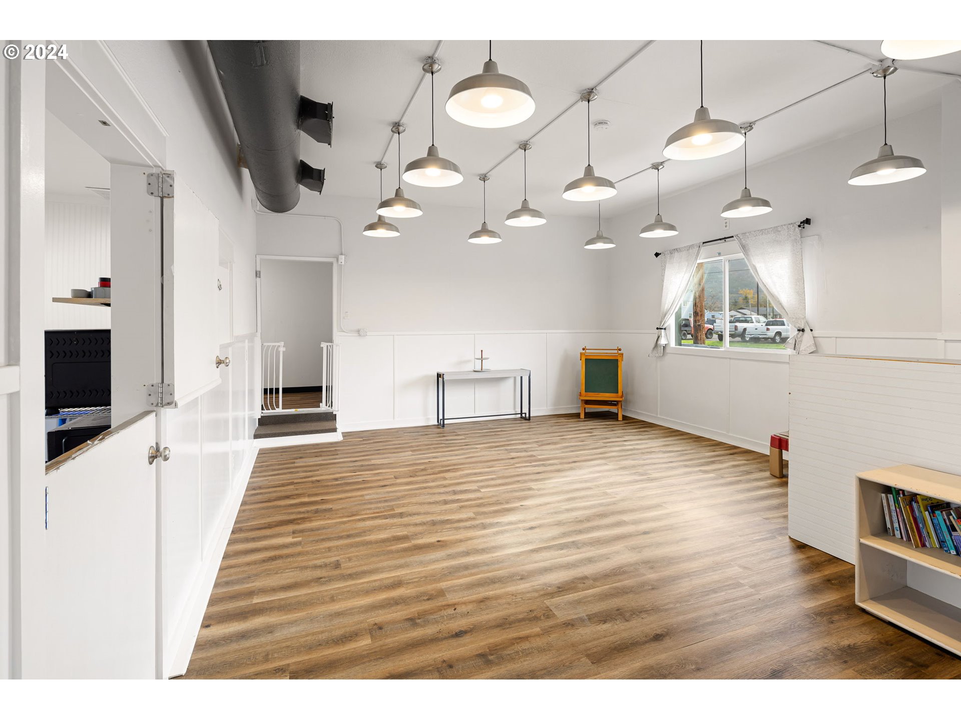 155 East Main Street Lowell, OR 97452 - Photo 14 of 17 a view of a living room and a flat screen tv