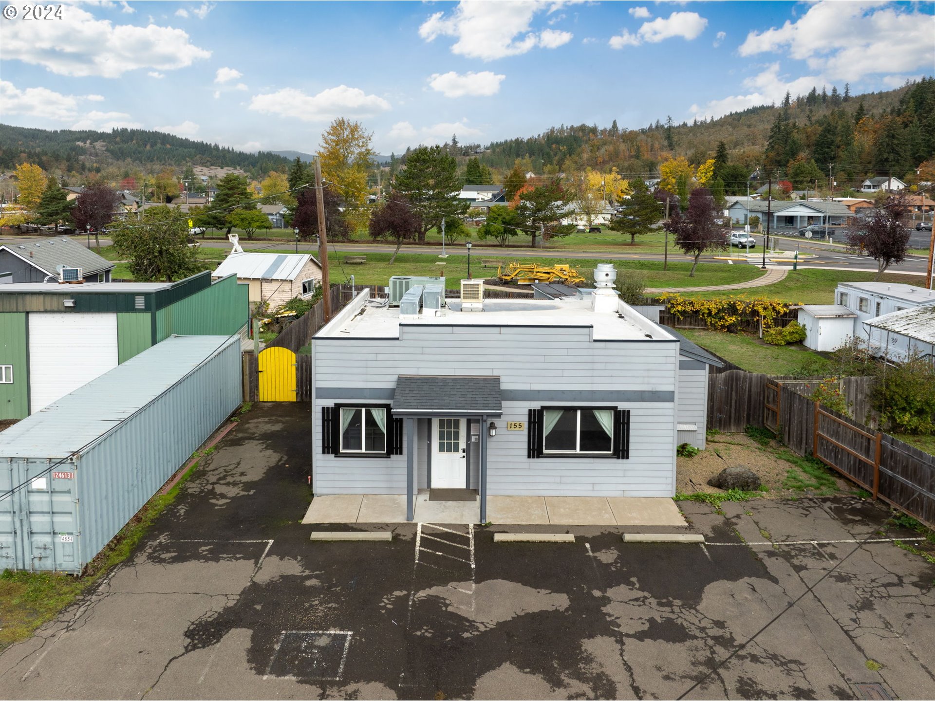 155 East Main Street Lowell, OR 97452 - Photo 2 of 17 a aerial view of a house with a ocean view