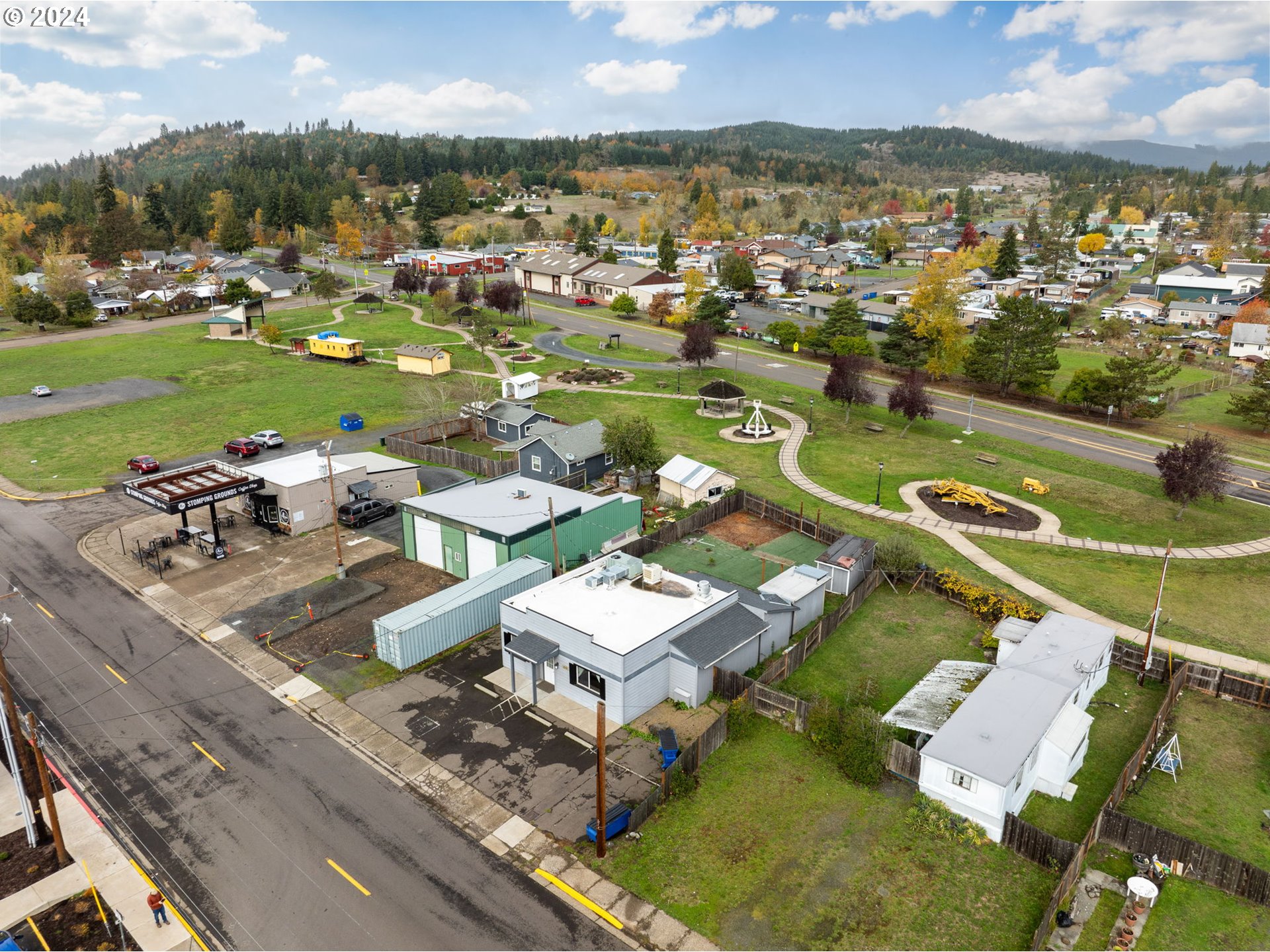 155 East Main Street Lowell, OR 97452 - Photo 3 of 17 an aerial view of a residential houses with outdoor space and river