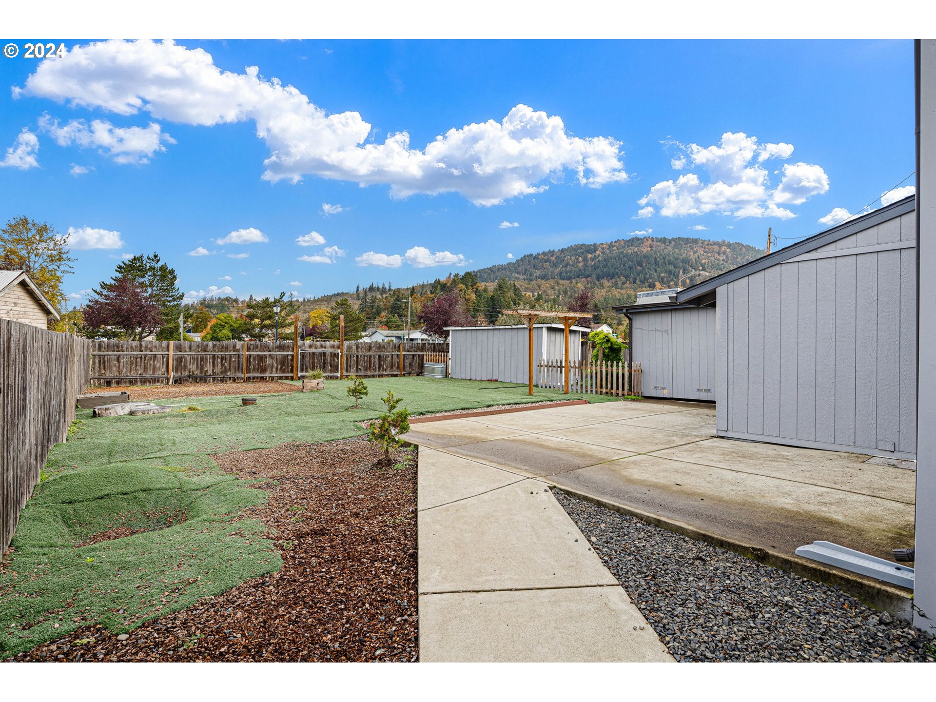 155 East Main Street Lowell, OR 97452 - Photo 6 of 17 a view of a house with a yard