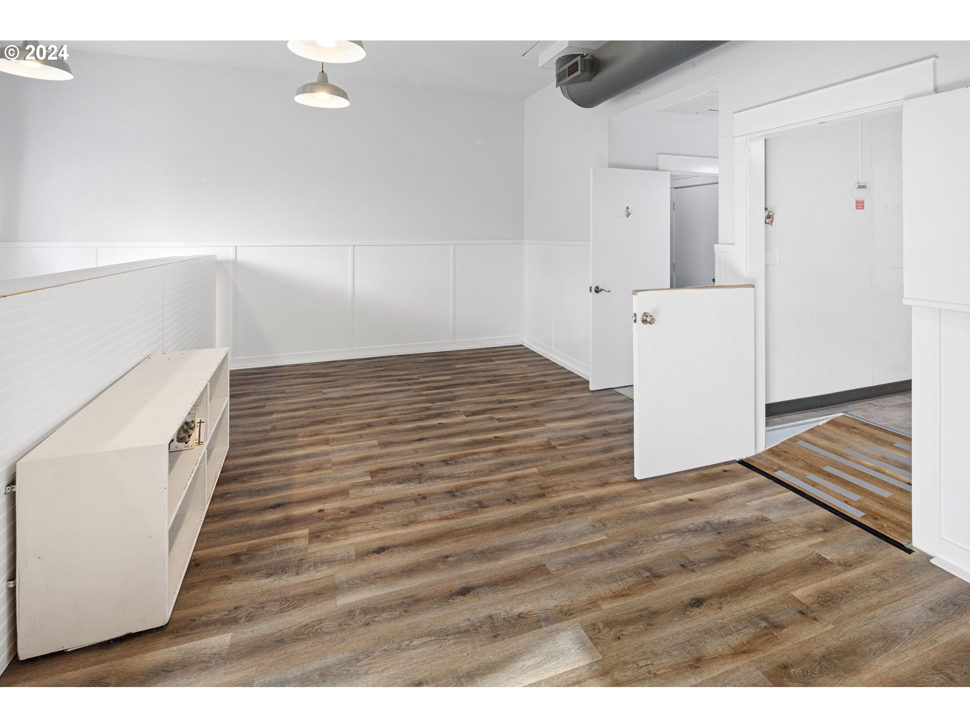 155 East Main Street Lowell, OR 97452 - Photo 9 of 17 a view of empty room with wooden floor