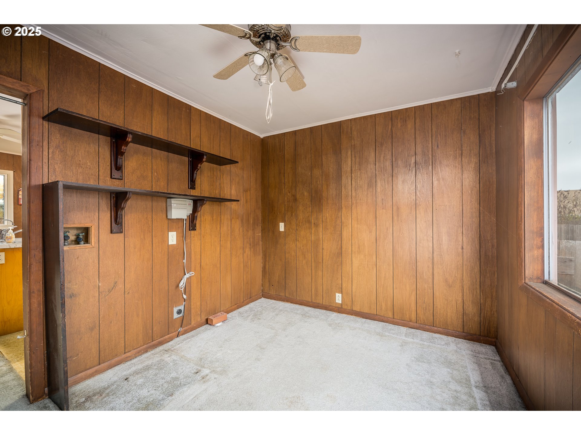 505 Broad Street South Monmouth, OR 97361 - Photo 11 of 28 a view of an empty room with a window