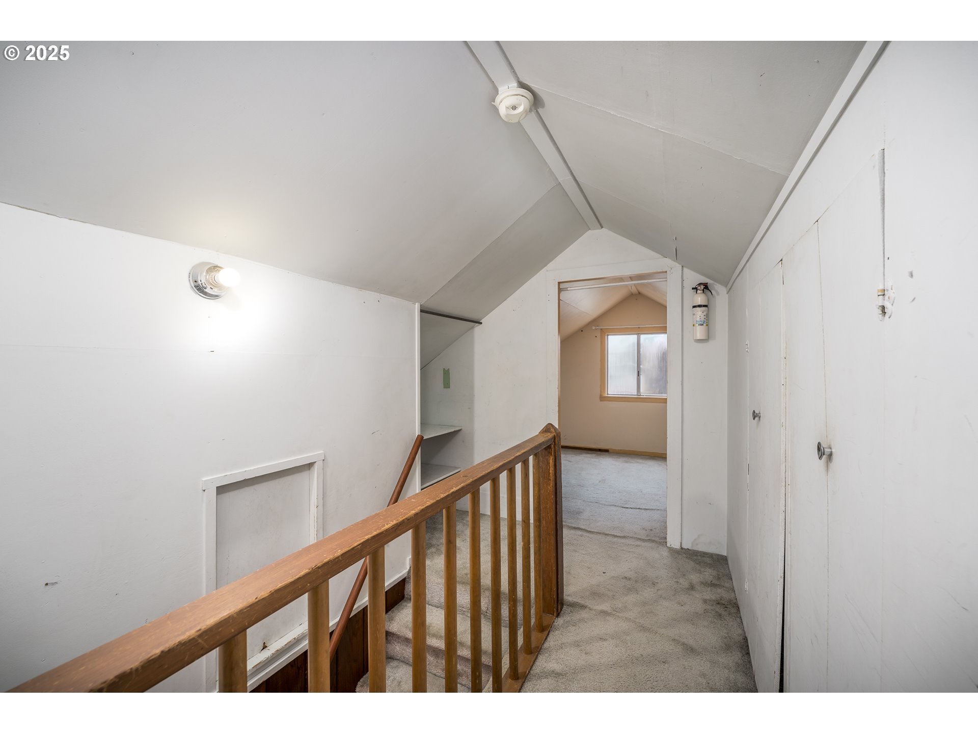 505 Broad Street South Monmouth, OR 97361 - Photo 12 of 28 a view of a hallway with wooden floor and stairs