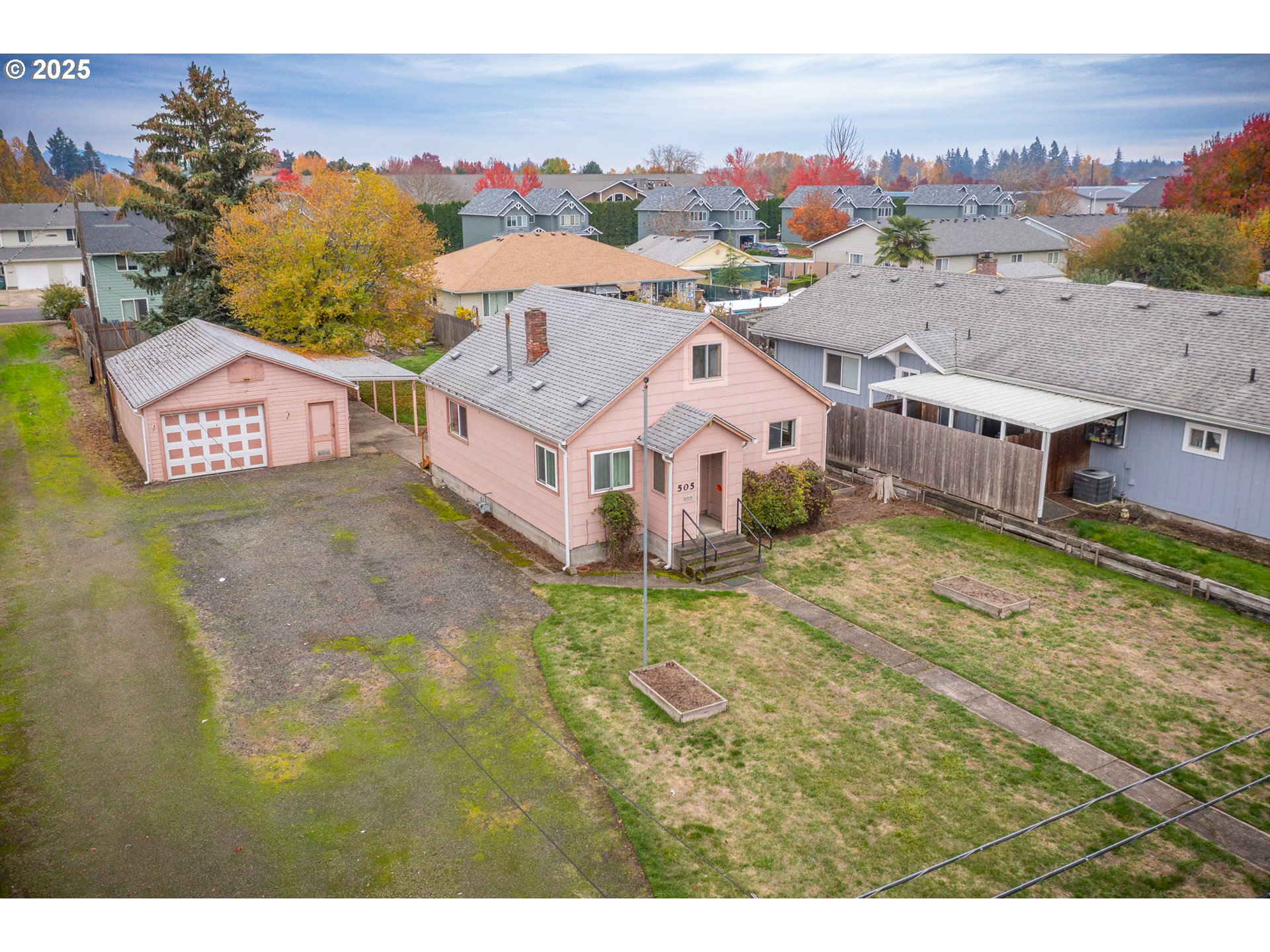 505 Broad Street South Monmouth, OR 97361 - Photo 24 of 28 a aerial view of a house with a garden and a yard