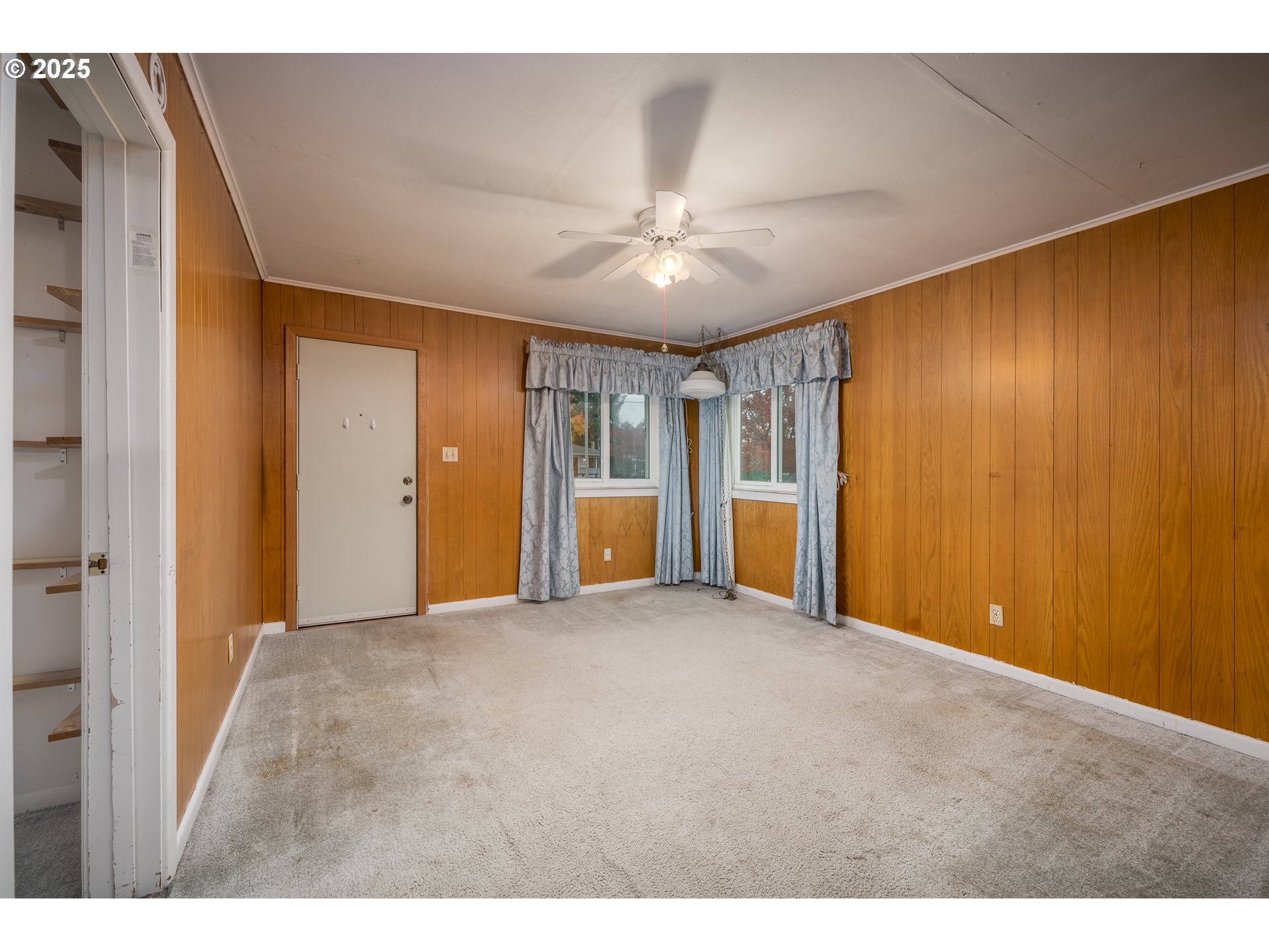 505 Broad Street South Monmouth, OR 97361 - Photo 6 of 28 a view of an empty room with closet and a window