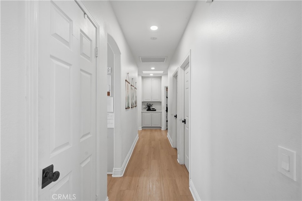 41110 Los Ranchos Circle Temecula, CA 92592 - Photo 37 of 77 a view of a hallway with wooden floor