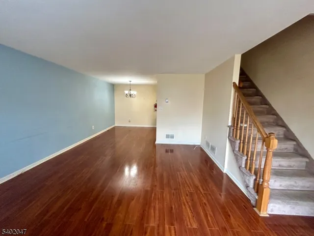 wooden floor in a hall with an entryway
