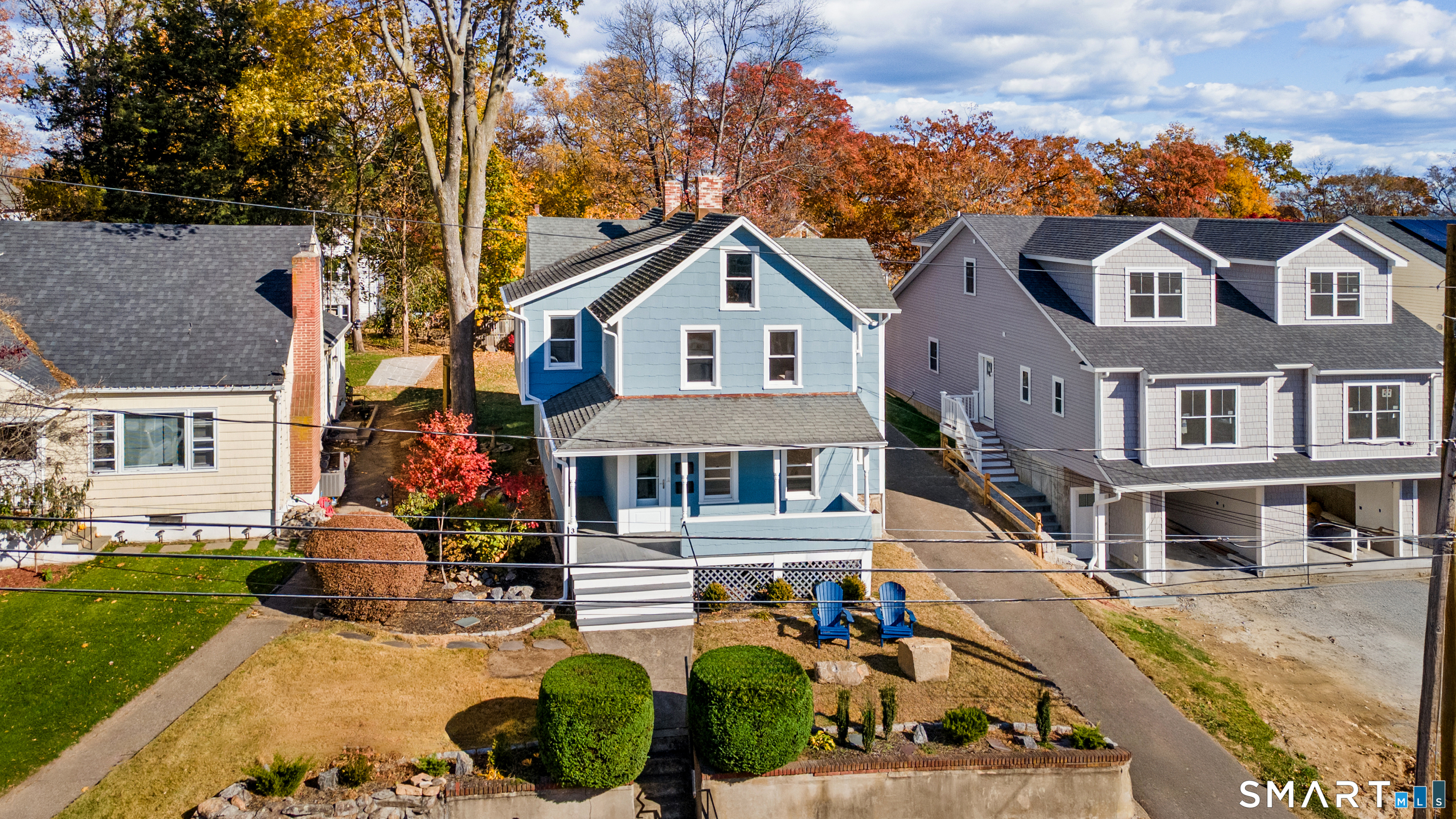 3 Edgewood Street Norwalk, CT 06854 - Photo 3 of 23 a front view of a house with a porch and a yard
