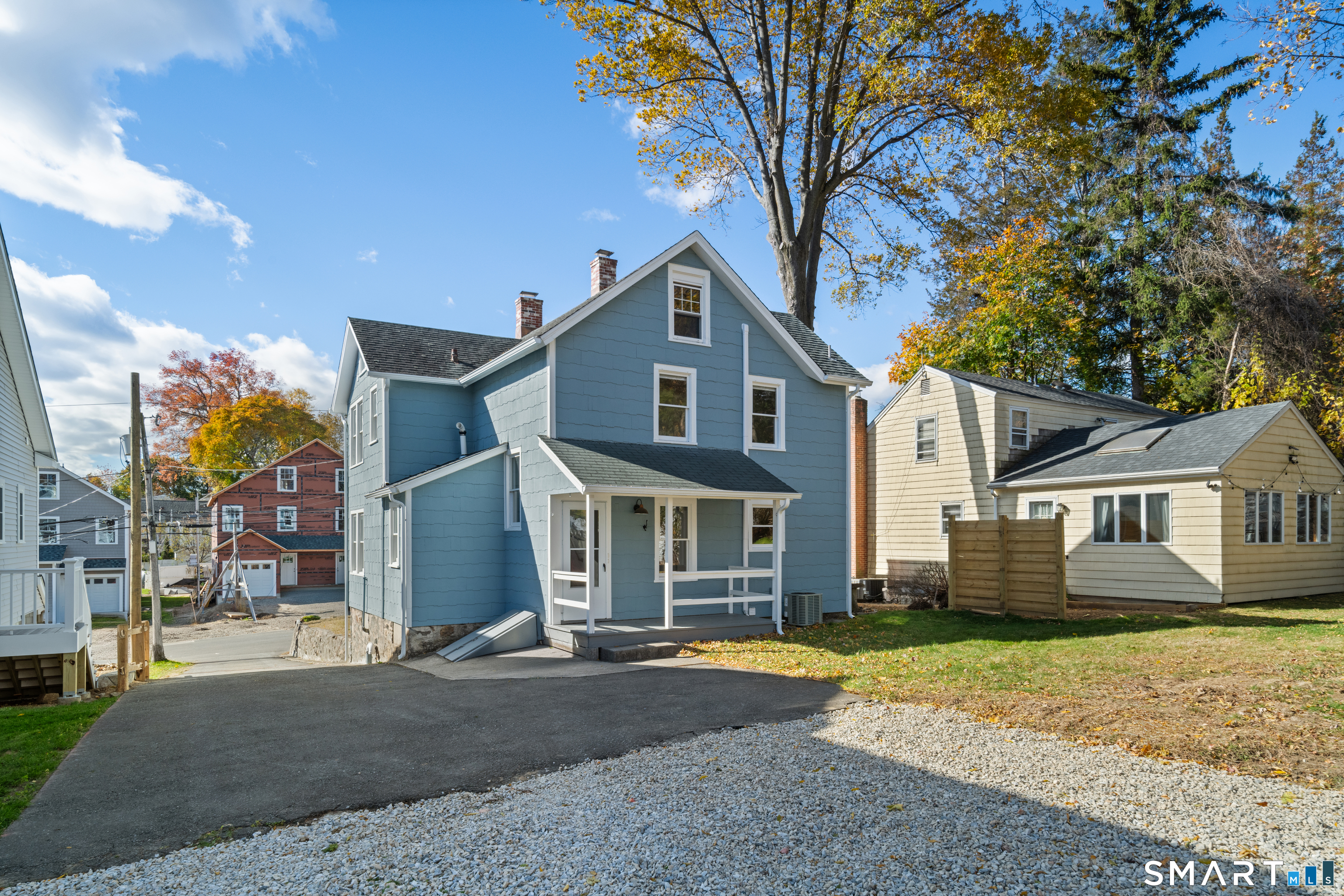 3 Edgewood Street Norwalk, CT 06854 - Photo 4 of 23 a front view of a house with a yard and large trees