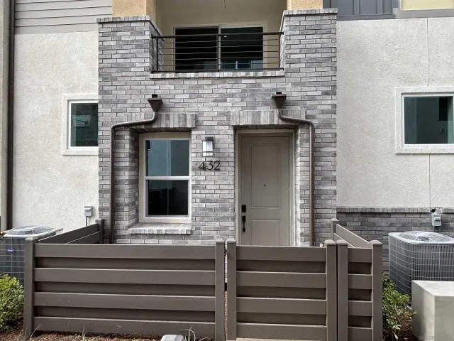 a front view of a house with stairs