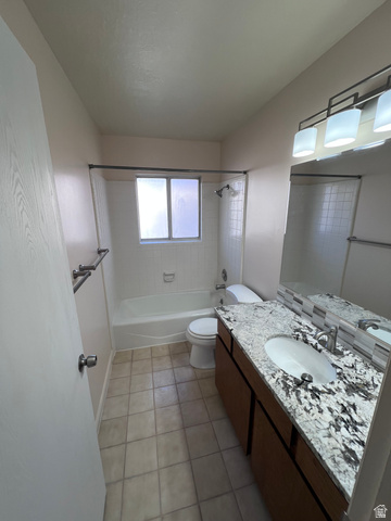 556 North Fairfield Road, Unit D4 Layton, UT 84041 - Photo 7 of 23 Full bath featuring tub / shower combination, vanity, and light tile patterned floors