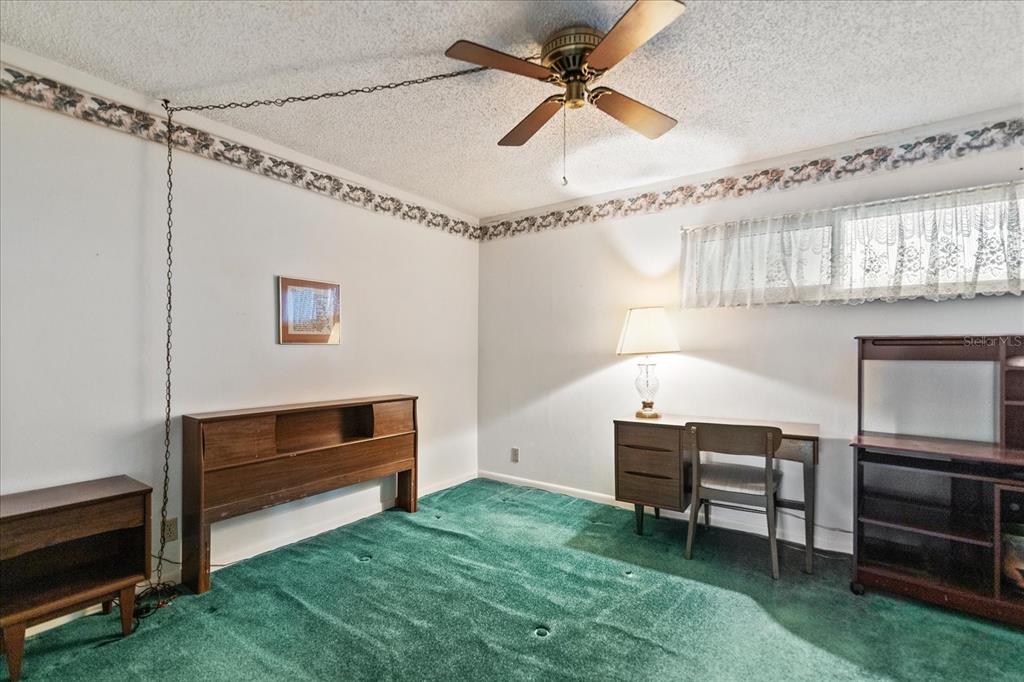 401 150th Avenue, Unit 251 Madeira Beach, FL 33708 - Photo 15 of 45 a living room with furniture and a piano