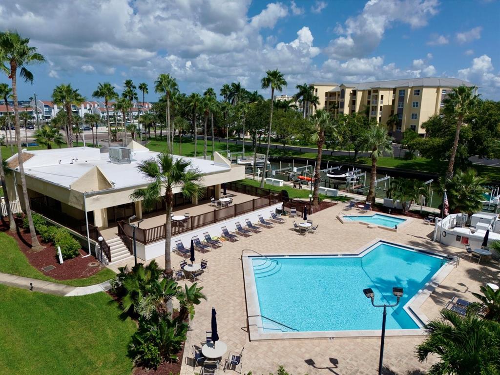401 150th Avenue, Unit 251 Madeira Beach, FL 33708 - Photo 2 of 45 an aerial view of a house with swimming pool garden and patio