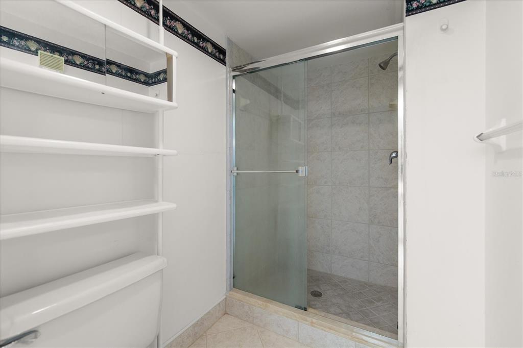 401 150th Avenue, Unit 251 Madeira Beach, FL 33708 - Photo 29 of 45 a bathroom with a shower