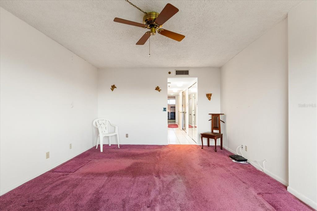 401 150th Avenue, Unit 251 Madeira Beach, FL 33708 - Photo 32 of 45 wooden floor in an empty room