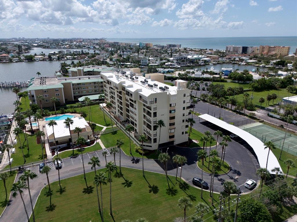 401 150th Avenue, Unit 251 Madeira Beach, FL 33708 - Photo 38 of 45 an aerial view of a house with a yard and lake view in back