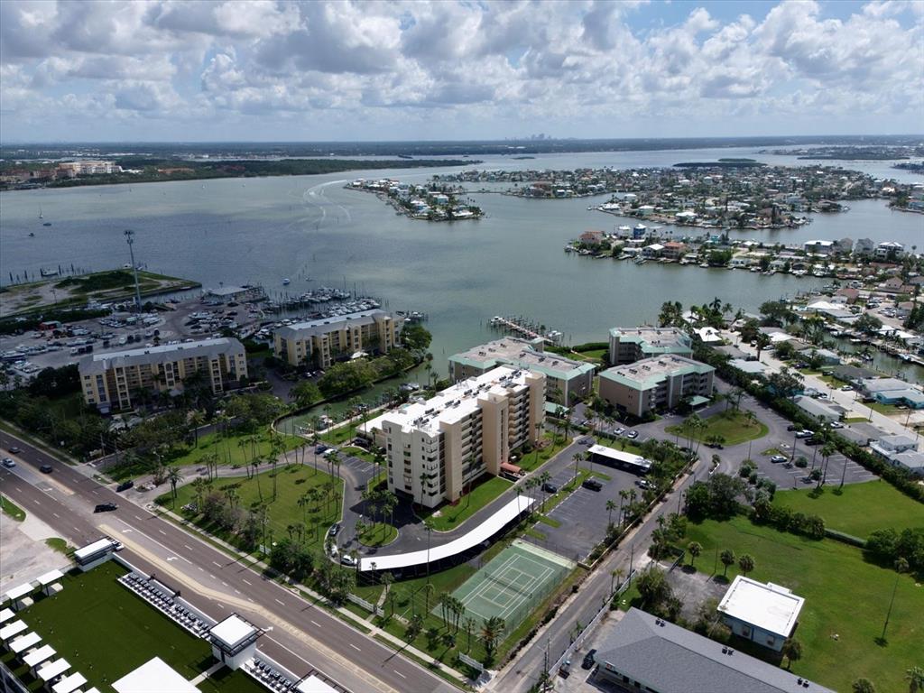 401 150th Avenue, Unit 251 Madeira Beach, FL 33708 - Photo 4 of 45 an aerial view of a residential houses with outdoor space and lake view
