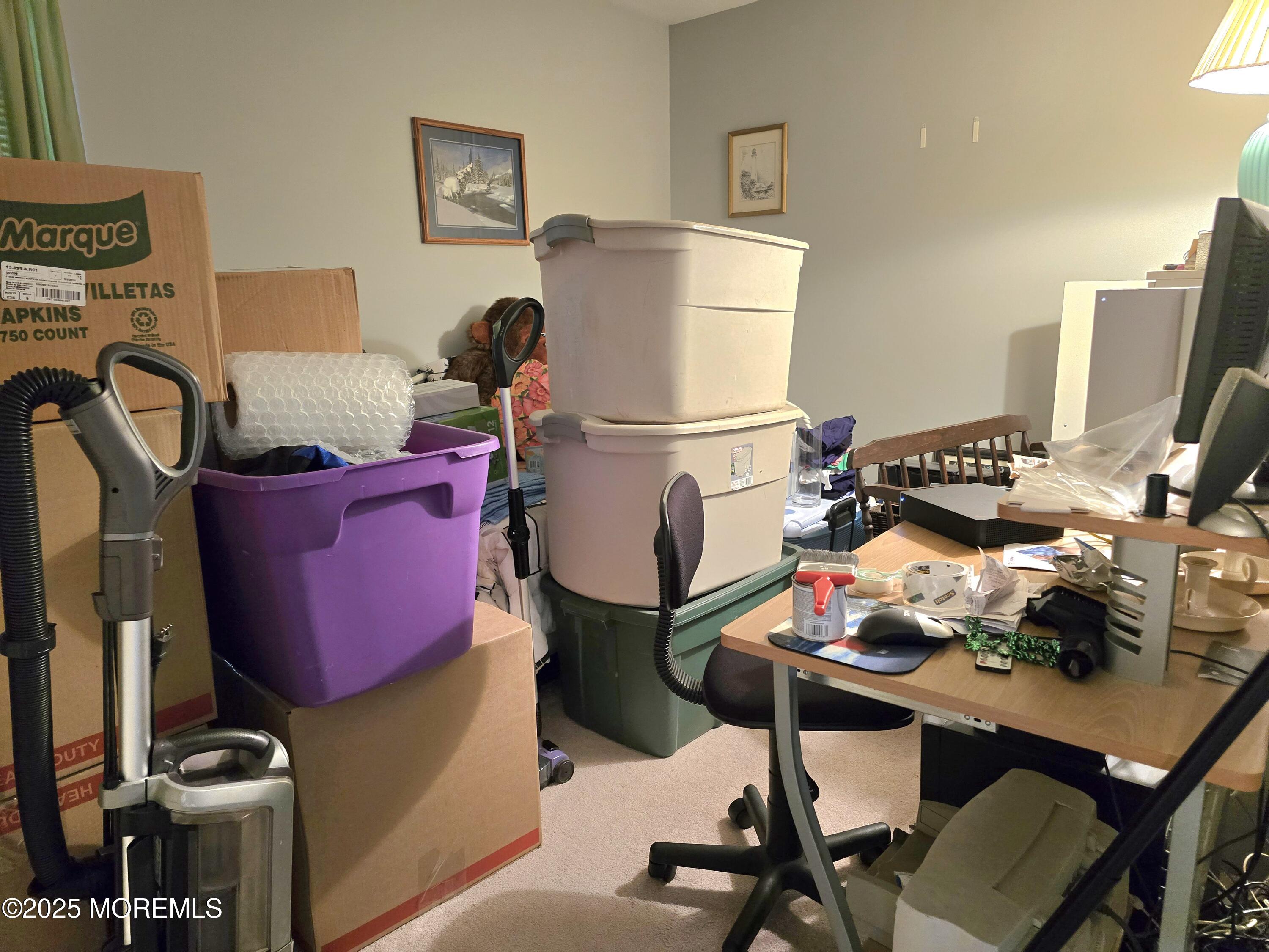 2126 Wainwright Road Toms River, NJ 08753 - Photo 19 of 28 a room with a table chairs and a refrigerator