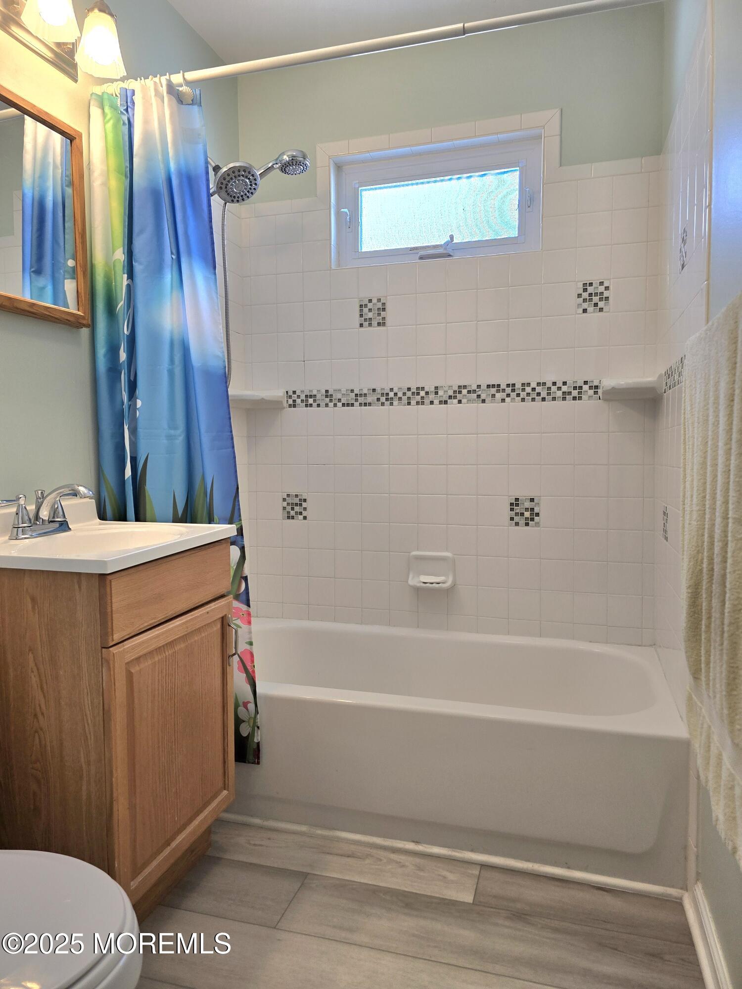 2126 Wainwright Road Toms River, NJ 08753 - Photo 20 of 28 a bathroom with a tub and a shower