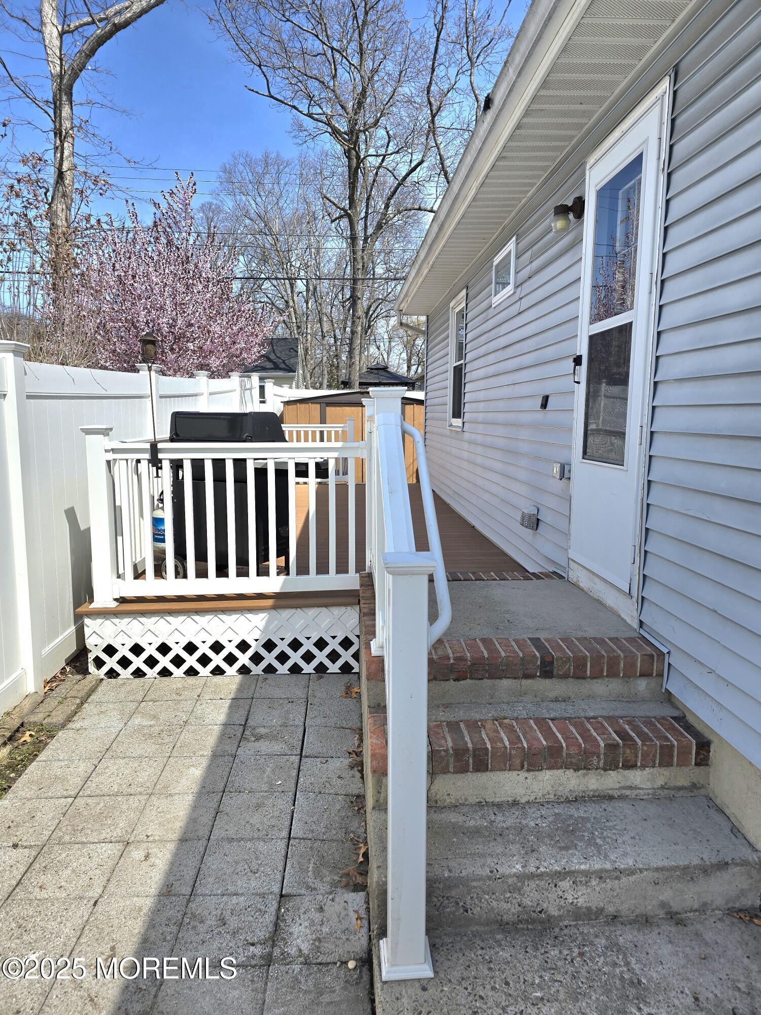 2126 Wainwright Road Toms River, NJ 08753 - Photo 24 of 28 a view of a white house with a yard