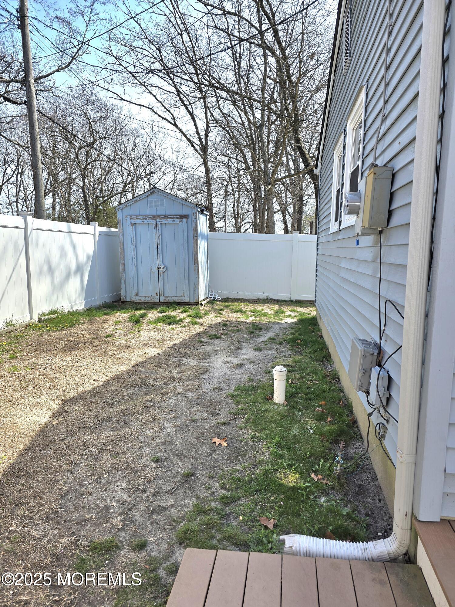 2126 Wainwright Road Toms River, NJ 08753 - Photo 27 of 28 a view of a backyard with wooden fence