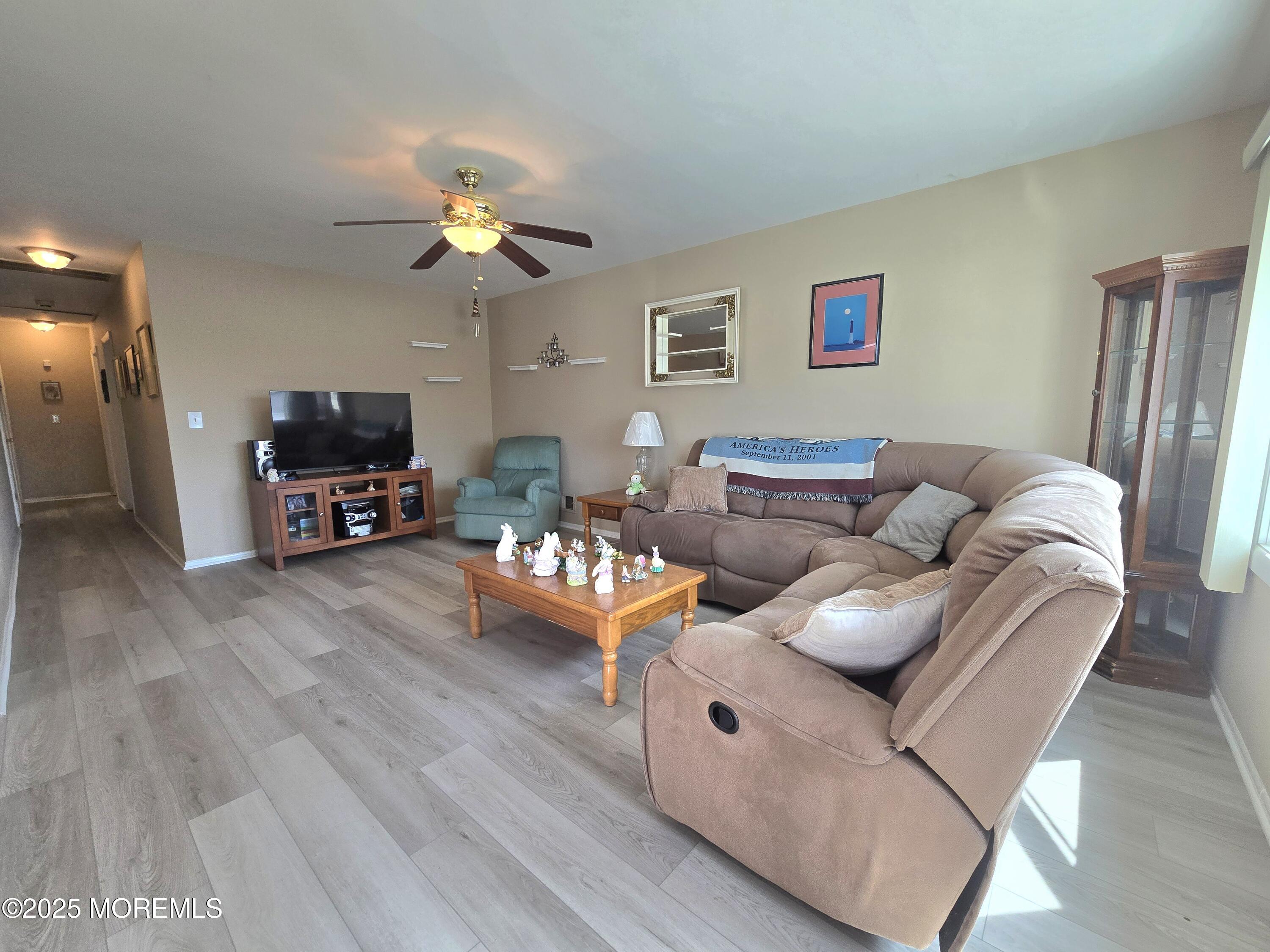 2126 Wainwright Road Toms River, NJ 08753 - Photo 4 of 28 a living room with furniture and a wooden floor