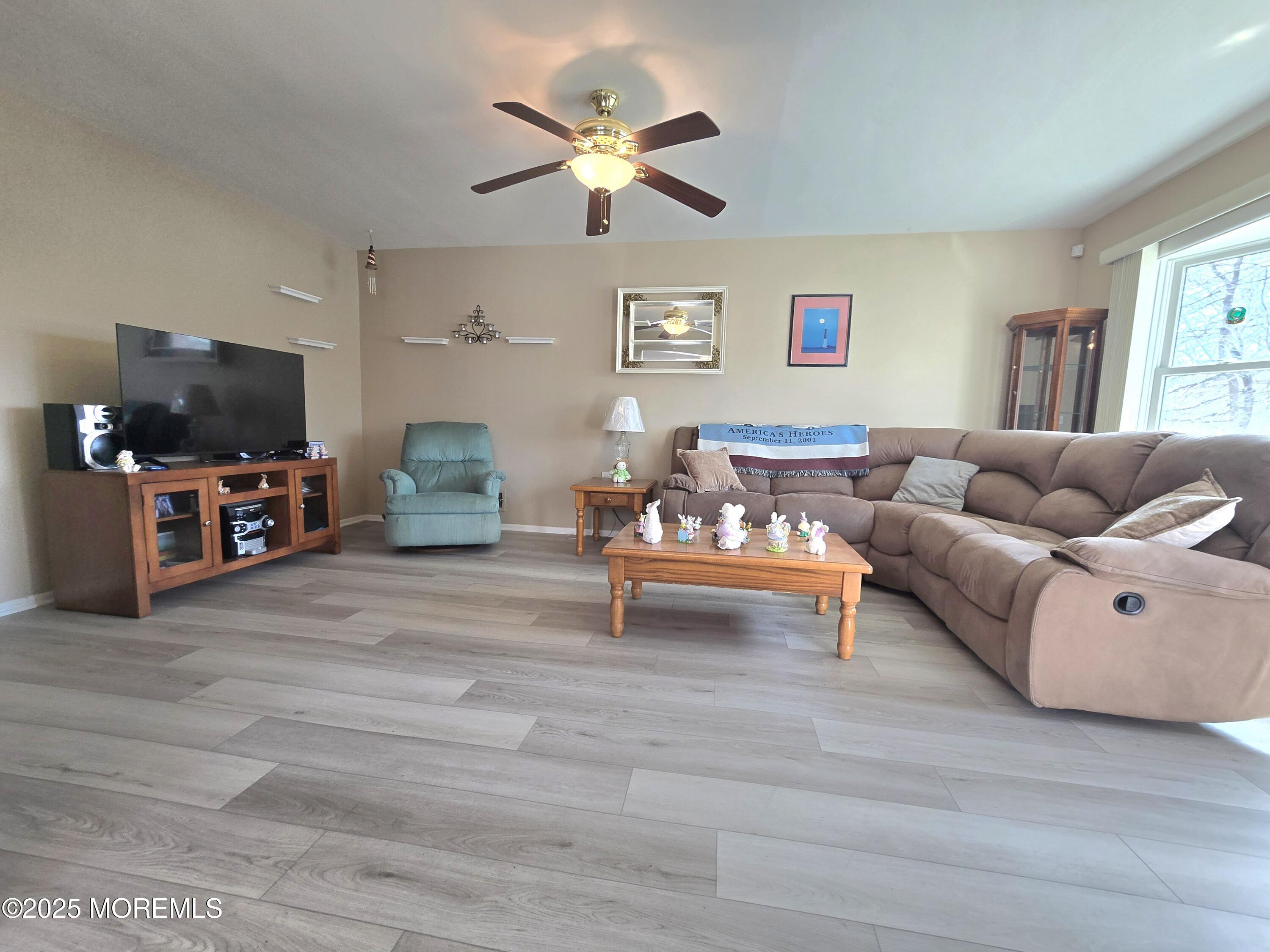 2126 Wainwright Road Toms River, NJ 08753 - Photo 5 of 28 a living room with furniture and a flat screen tv