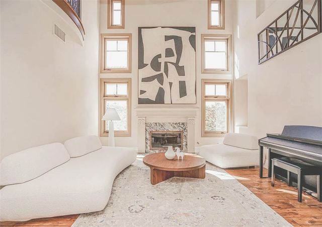 a kitchen with a stove window and cabinets
