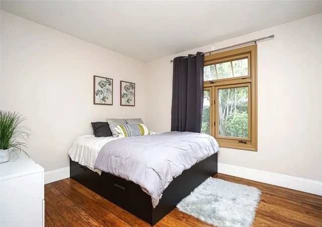 a view of an entryway with wooden floor