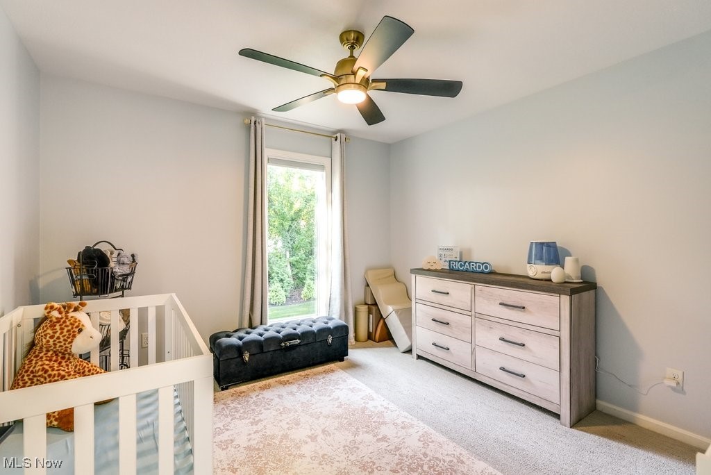 1598 Graham Road Silver Lake, OH 44224 - Photo 33 of 46 Carpeted bedroom with multiple windows, a crib, and ceiling fan