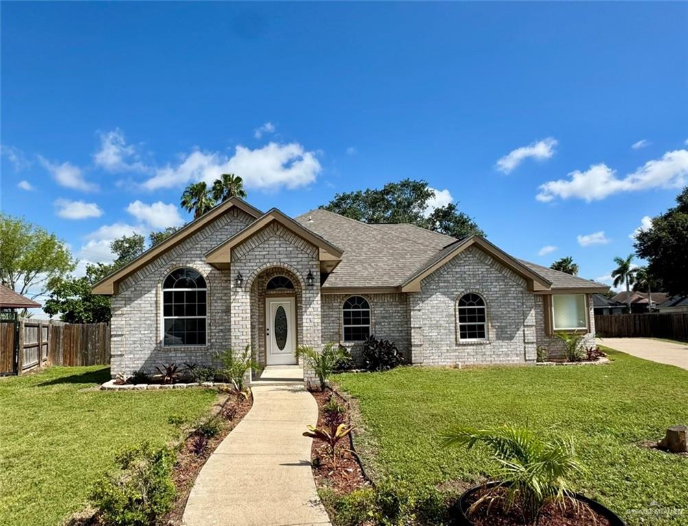 2207 Turtle Court Mission, TX 78572 - Photo 1 of 22 a front view of a house with a garden