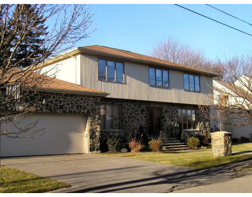 7 Ida Road Marblehead, MA 01945 - Photo 1 of 16 a front view of a house with garden