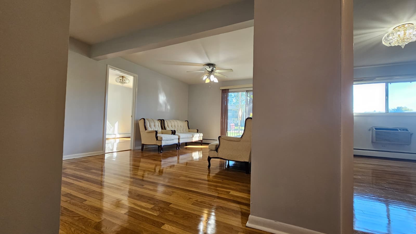 9588 Terrace Place, Unit 1C Des Plaines, IL 60016 - Photo 6 of 8 a view of a living room with furniture and a chandelier