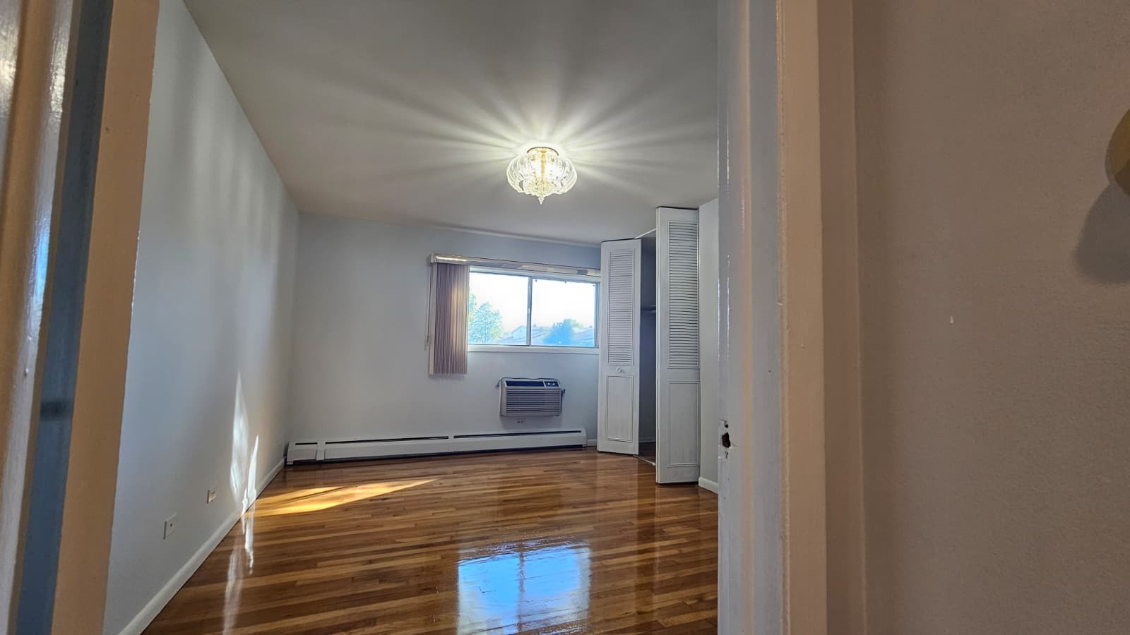 9588 Terrace Place, Unit 1C Des Plaines, IL 60016 - Photo 7 of 8 a view of room with a ceiling fan and window