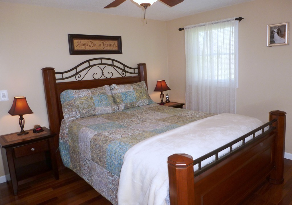 15 Old Wales Road Monson, MA 01057 - Photo 14 of 24 a bedroom with a bed and a lamp on dresser