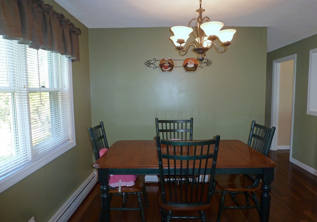 15 Old Wales Road Monson, MA 01057 - Photo 5 of 24 a view of a dining room with furniture wooden floor and a chandelier