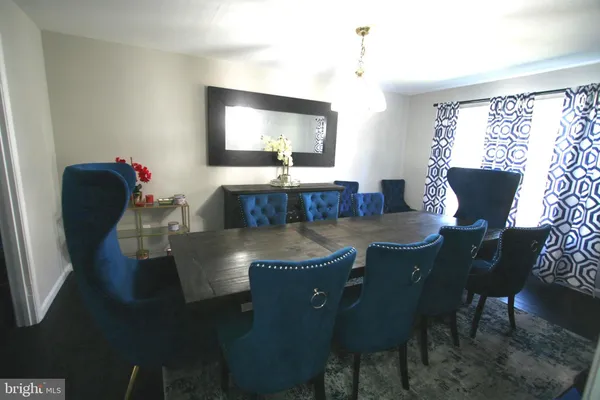 a kitchen with stainless steel appliances a stove a microwave a sink a stove and a refrigerator