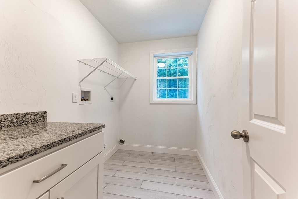 119 County Road Marion, MA 02738 - Photo 5 of 12 a bathroom with a granite countertop sink and shower