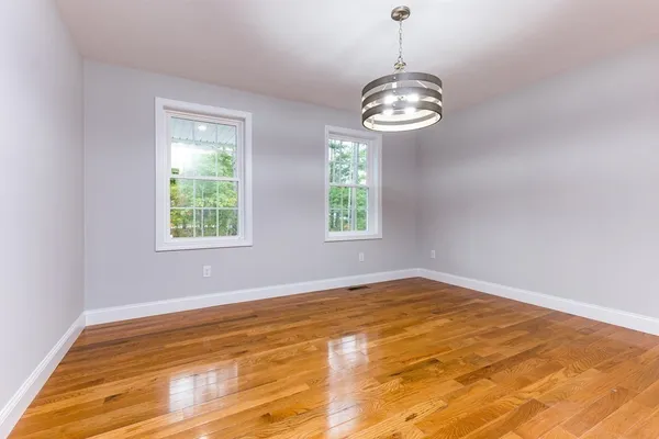 a view of kitchen with wooden floor