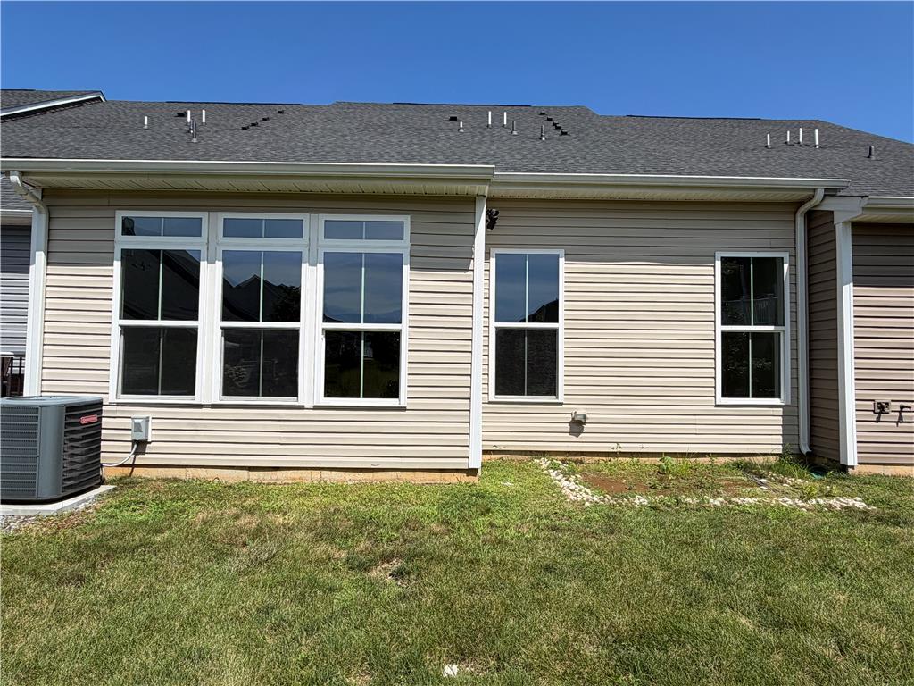 4758 Rafi Road Easton, PA 18045 - Photo 57 of 57 Vinyl siding and tall double-hung windows define the rear exterior of this home.