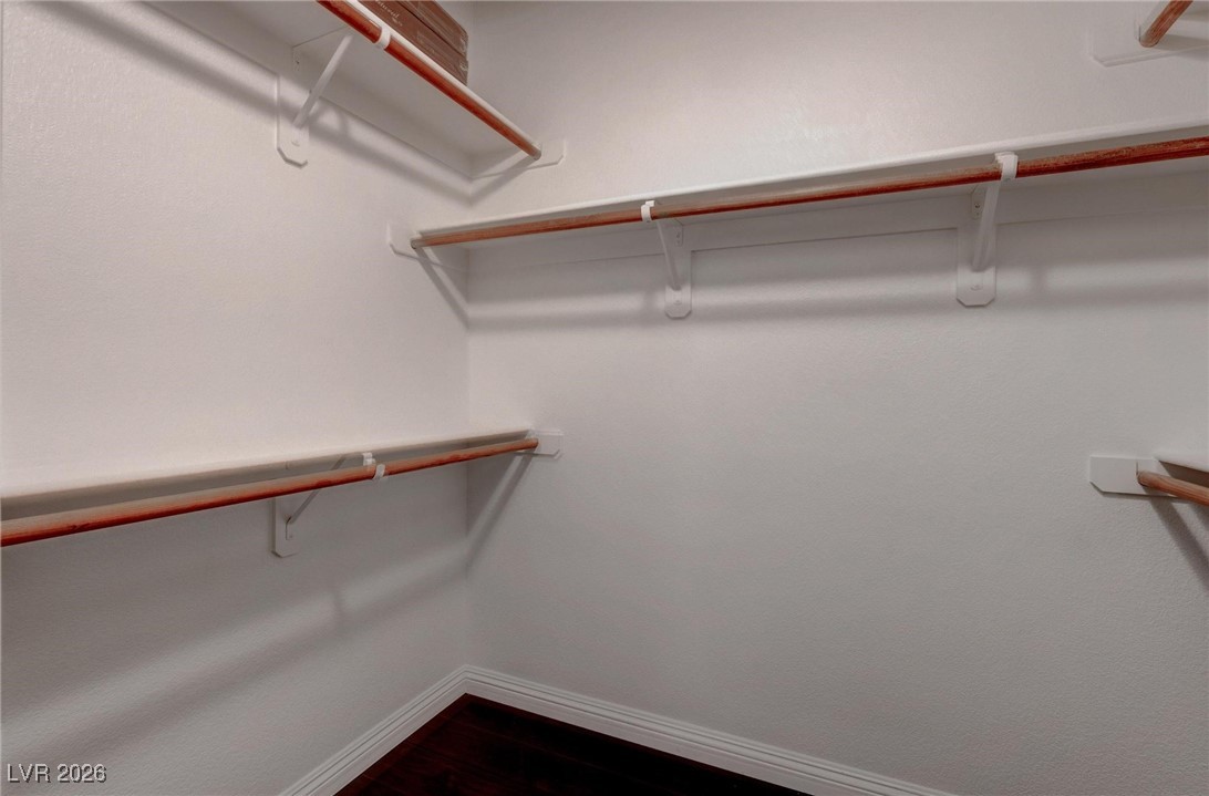 2305 West Horizon Ridge Parkway, Unit 3921 Henderson, NV 89052 - Photo 11 of 31 Walk in closet featuring dark wood-type flooring