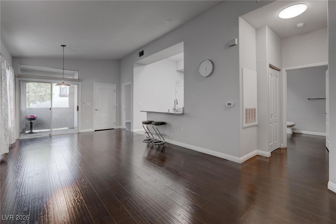2305 West Horizon Ridge Parkway, Unit 3921 Henderson, NV 89052 - Photo 16 of 31 Unfurnished living room featuring wood finished floors