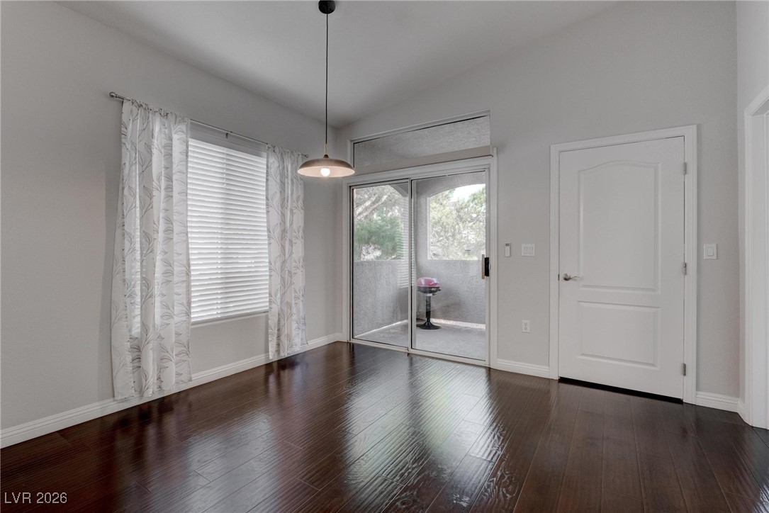 2305 West Horizon Ridge Parkway, Unit 3921 Henderson, NV 89052 - Photo 17 of 31 Unfurnished dining area with vaulted ceiling and wood finished floors