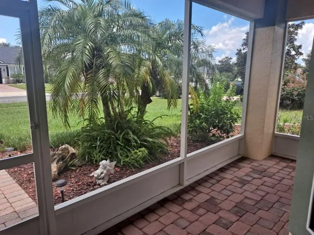 a view of a garden from a balcony