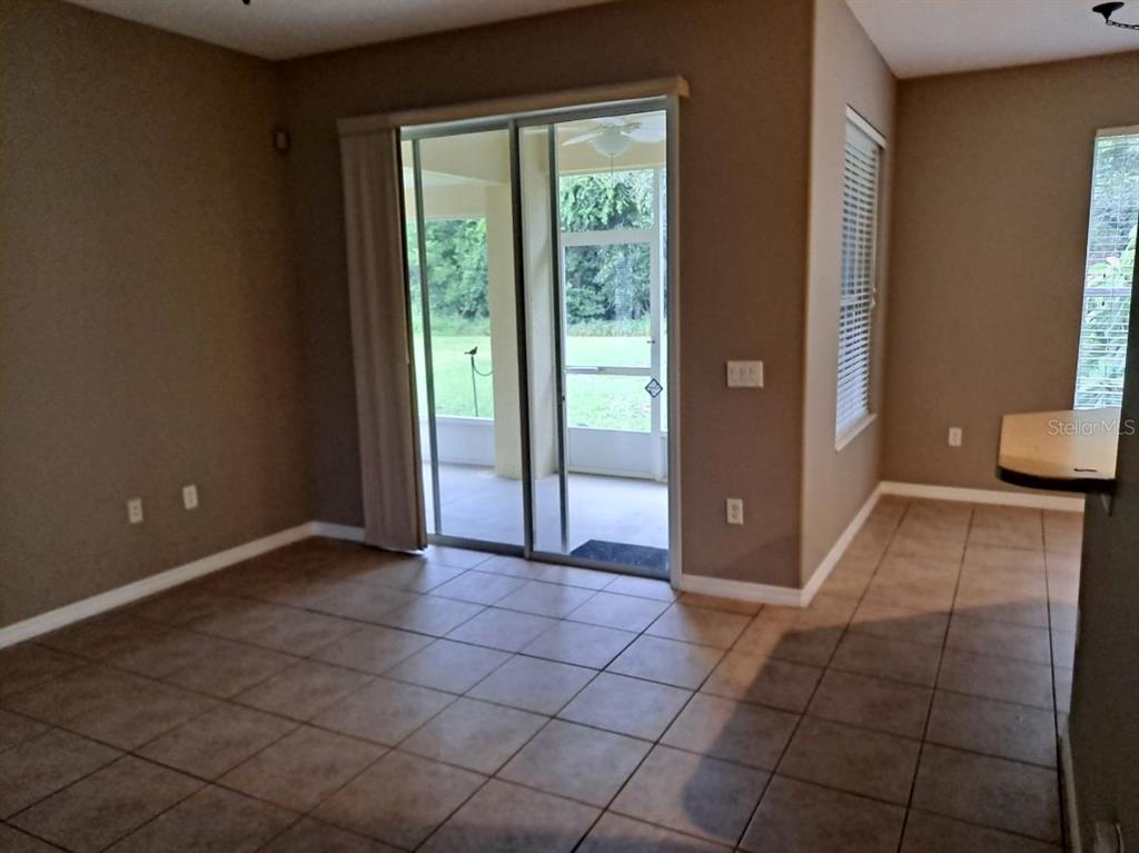 13534 Biscayne Grove Lane Grand Island, FL 32735 - Photo 3 of 12 a view of a livingroom with an empty space and a window