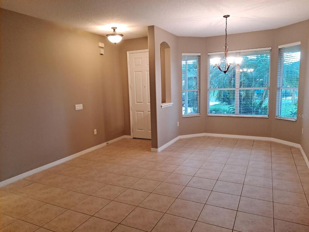 13534 Biscayne Grove Lane Grand Island, FL 32735 - Photo 5 of 12 a view of an empty room with a window