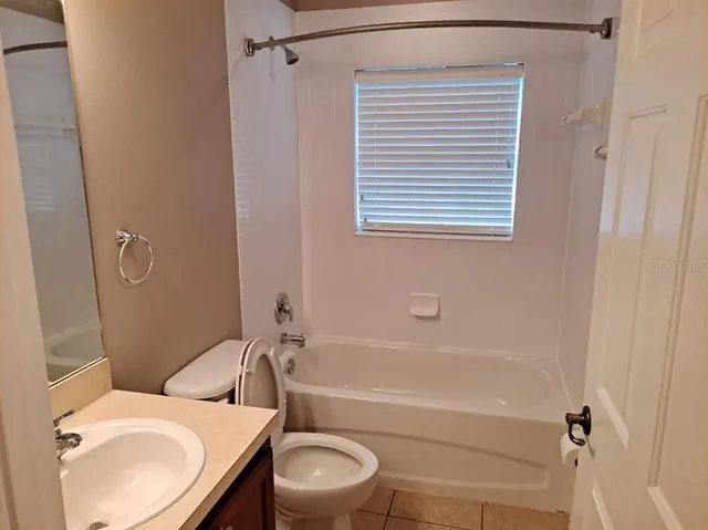 a bathroom with a sink toilet and bathtub