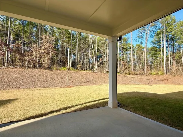 a view of a room with yard from balcony