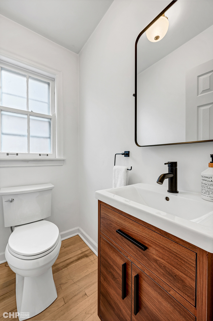 316 Nuttall Road Riverside, IL 60546 - Photo 16 of 40 a bathroom with a sink a toilet and mirror