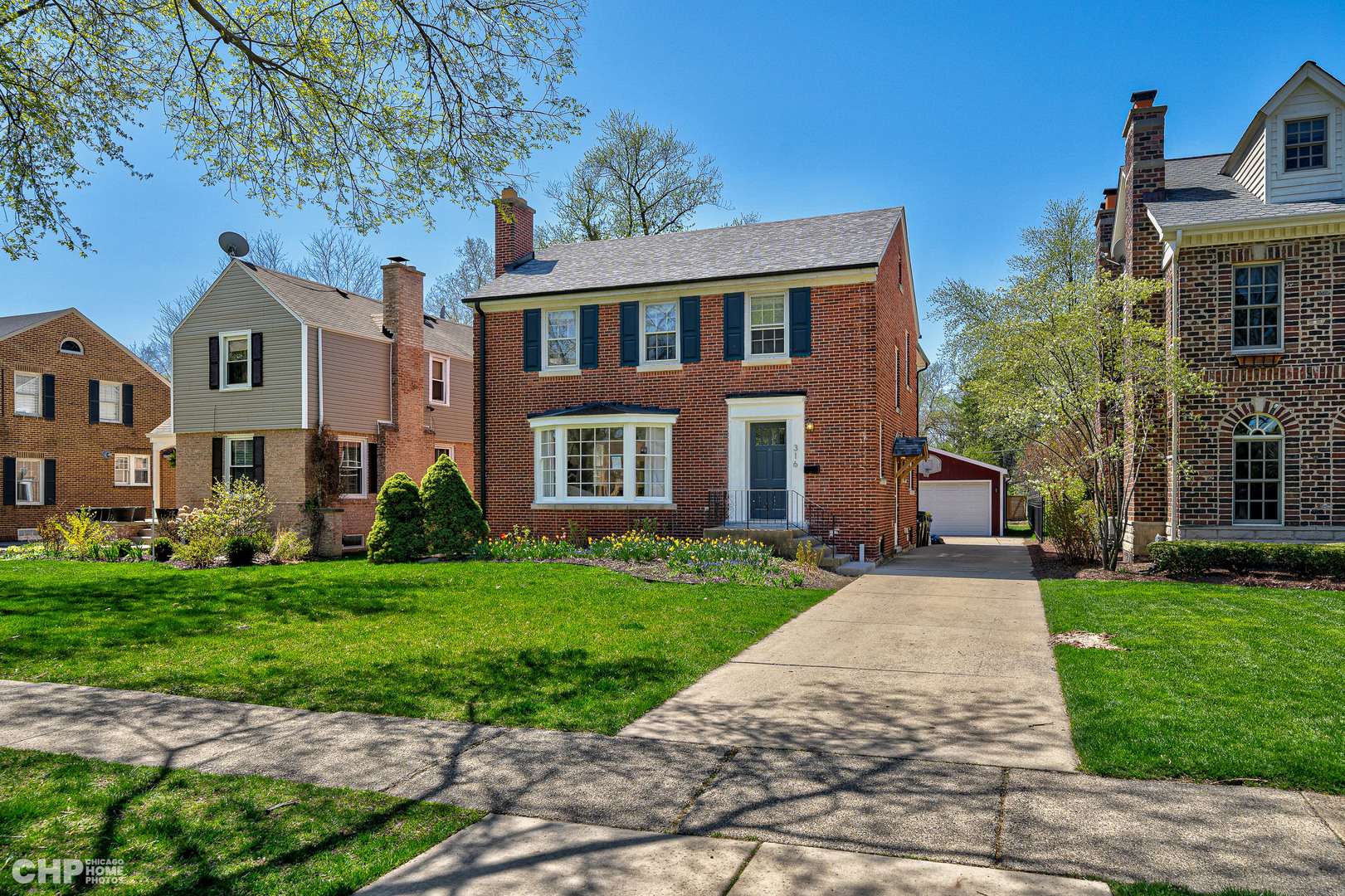 316 Nuttall Road Riverside, IL 60546 - Photo 2 of 40 a front view of a house with a yard